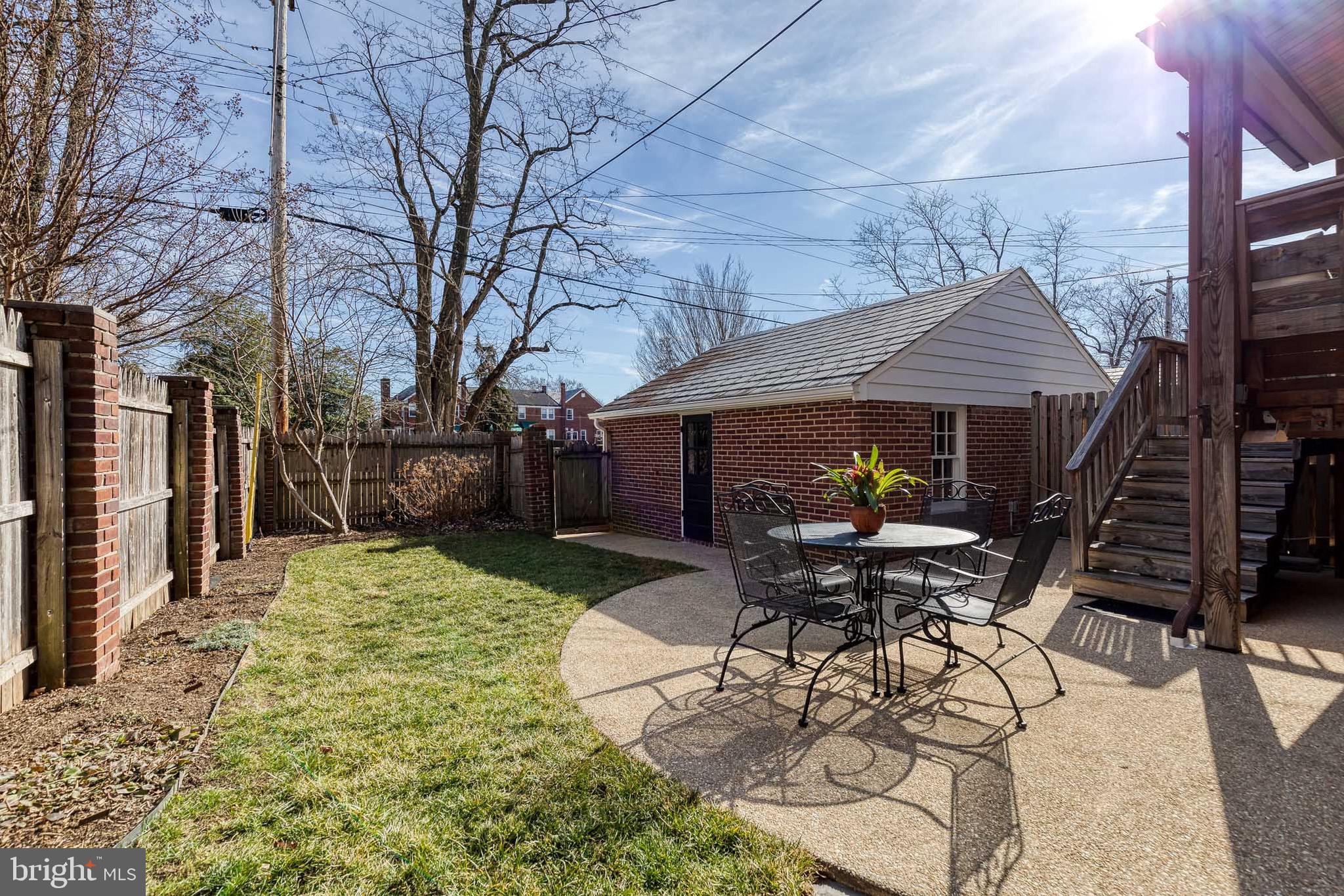 45 Dunkirk Road Baltimore, MD 21212 - Photo 40 of 45 a view of a patio with table and chairs with wooden fence and plants