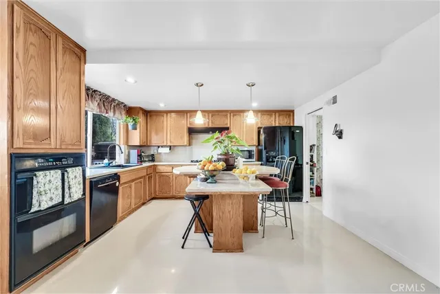 a view of a kitchen and dining room