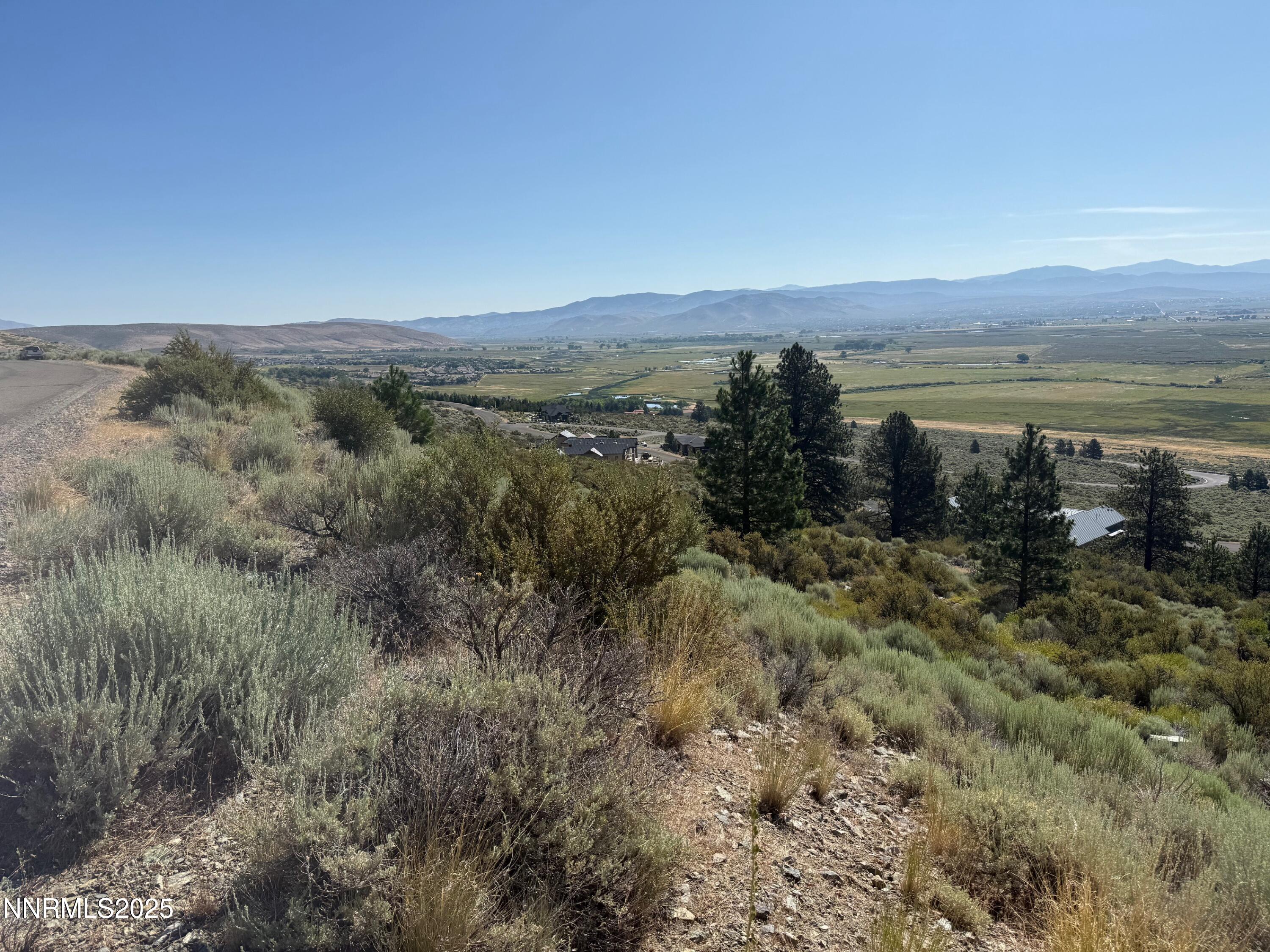 2592 Eagle Ridge Road, Unit 29 Genoa, NV 89411 - Photo 3 of 11 a view of a lake with a mountain in the background