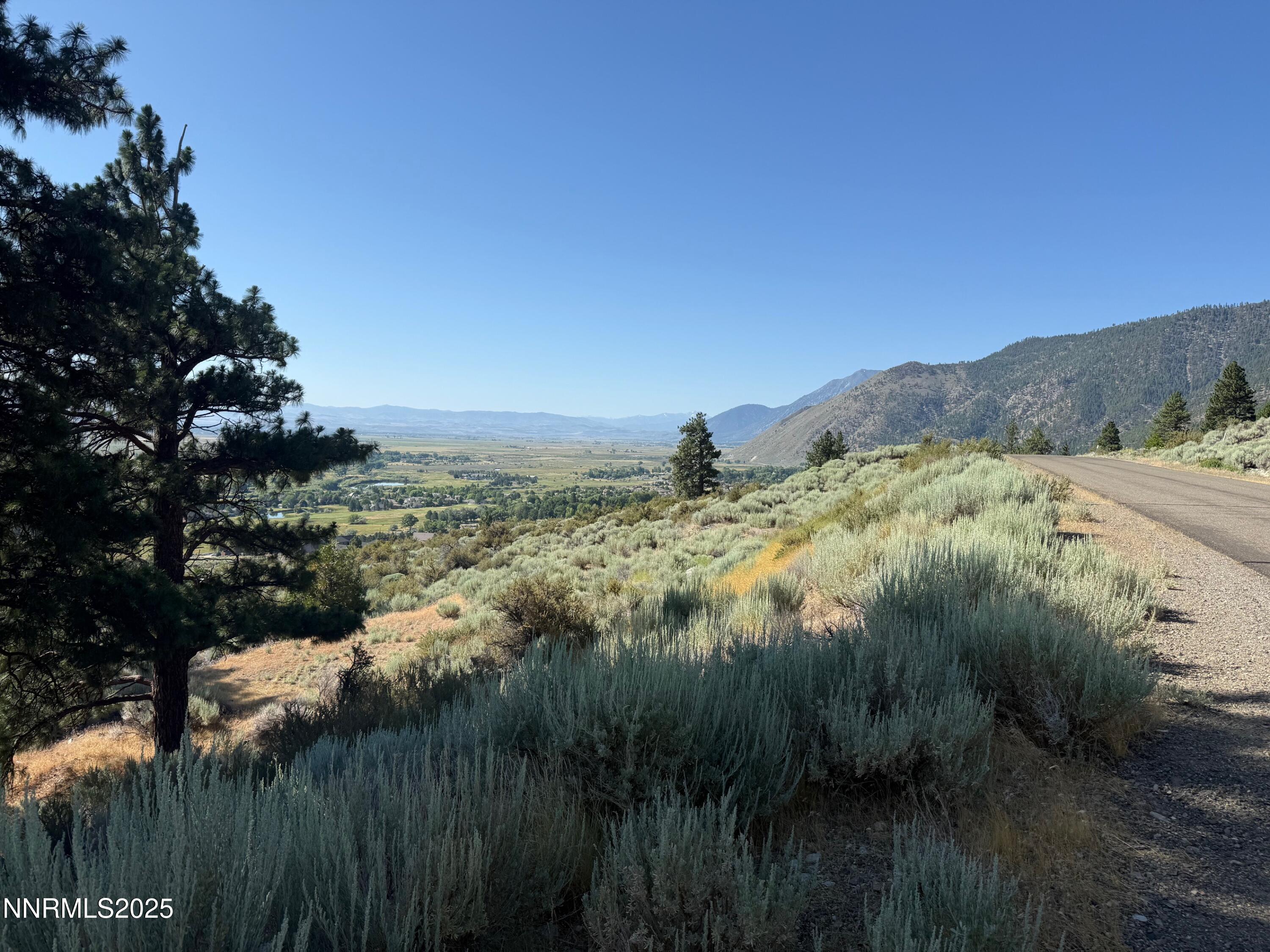2592 Eagle Ridge Road, Unit 29 Genoa, NV 89411 - Photo 6 of 11 a view of a lake with a yard and mountain view
