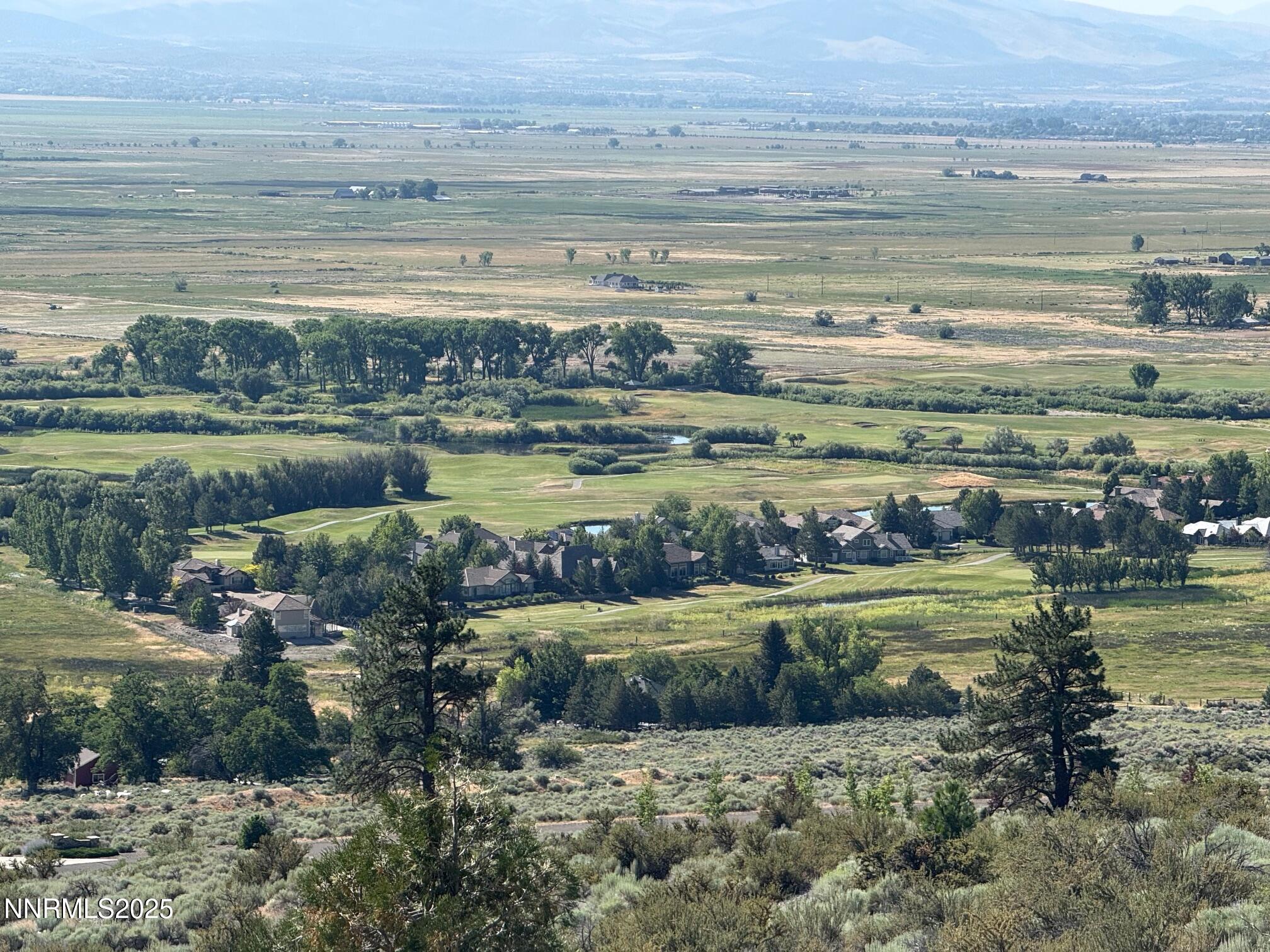 2592 Eagle Ridge Road, Unit 29 Genoa, NV 89411 - Photo 7 of 11 a view of a lake with a big yard