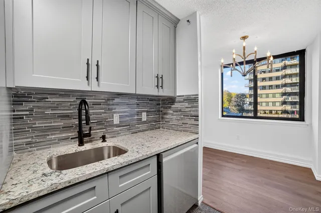 a view of a kitchen cabinets and a wooden floor