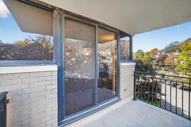 a spacious bedroom with a large bed and a large window