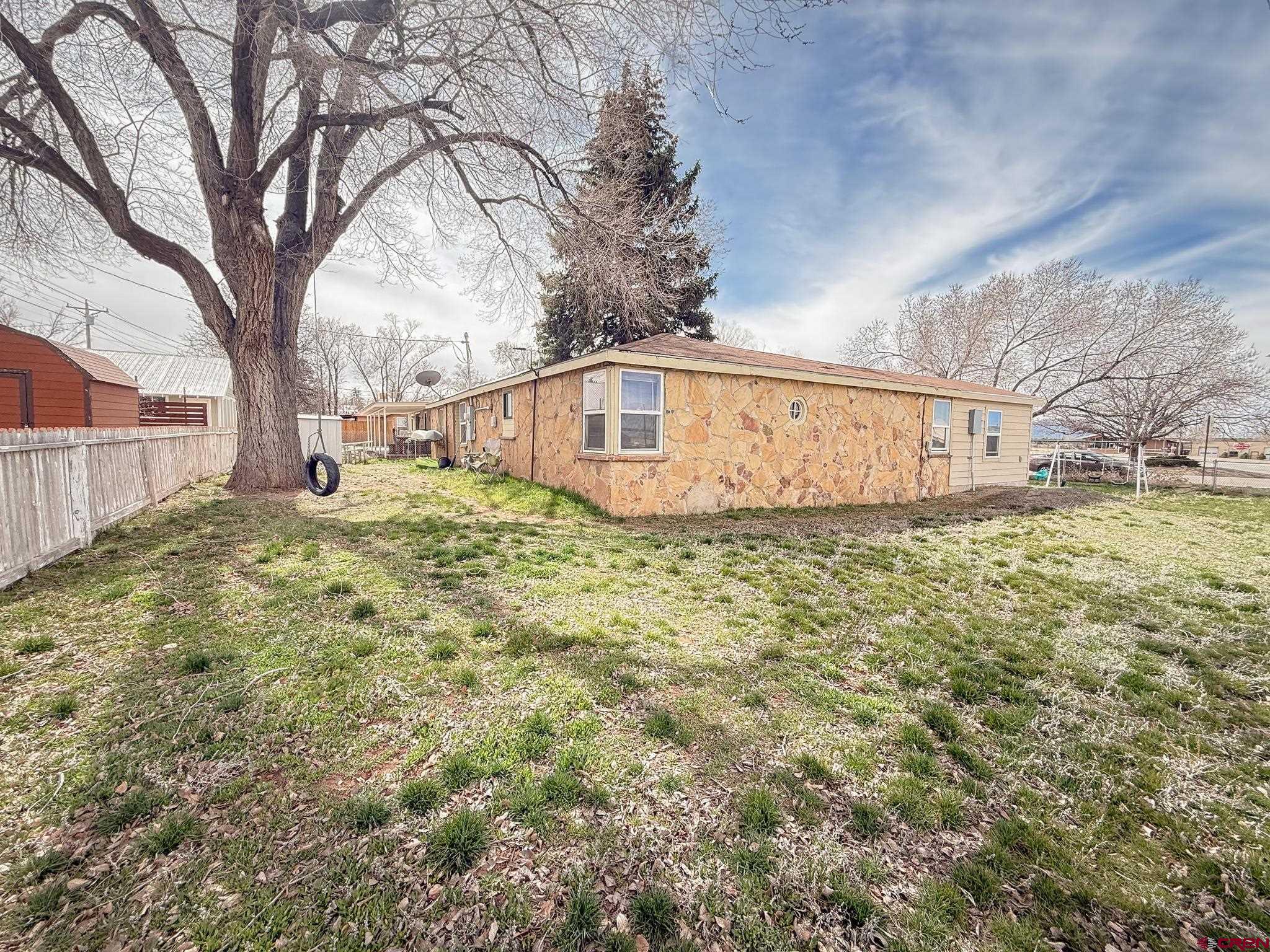 432 North Linden Street Cortez, CO 81321 - Photo 1 of 27 a view of a house with a yard