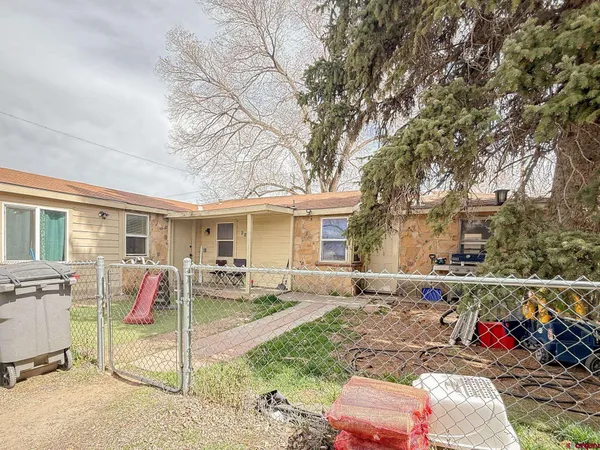 a bedroom with furniture and a wooden floor