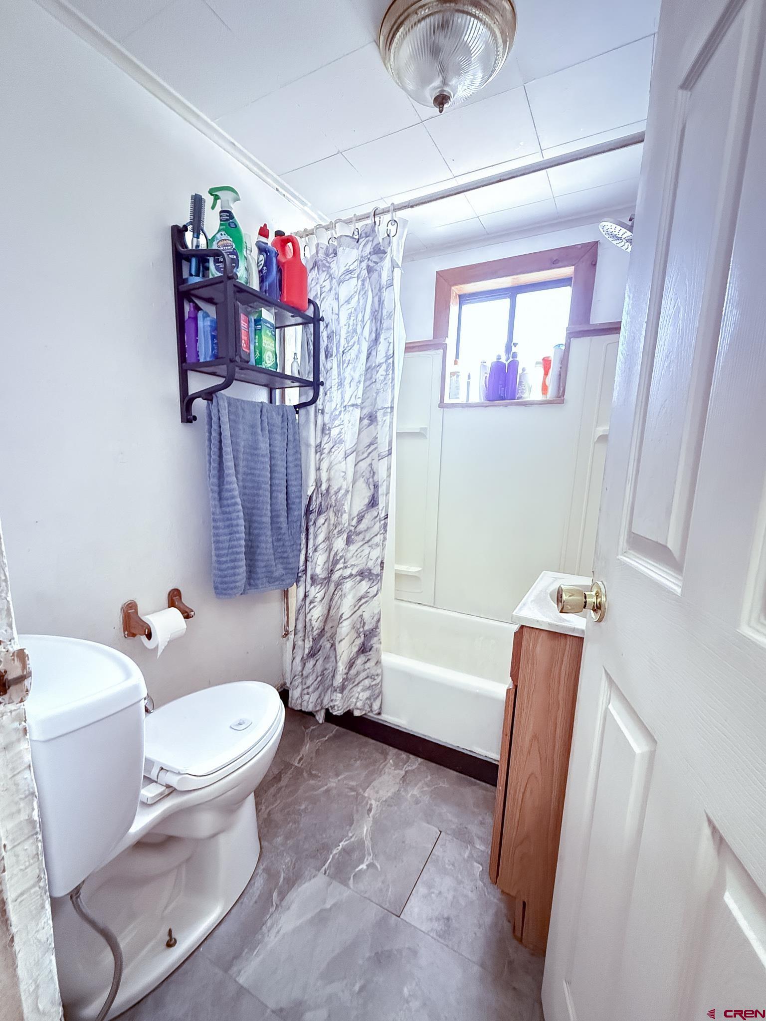432 North Linden Street Cortez, CO 81321 - Photo 14 of 27 a bathroom with a sink toilet and shower