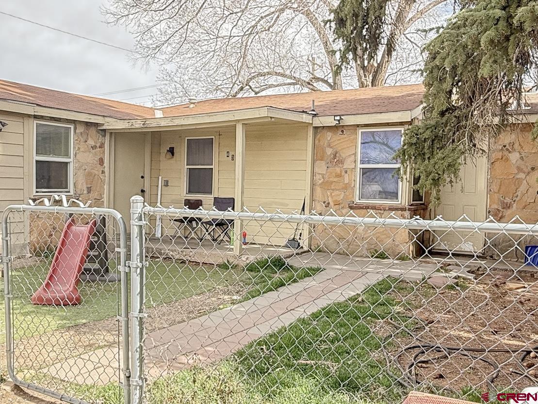 432 North Linden Street Cortez, CO 81321 - Photo 2 of 27 a front view of a house with patio