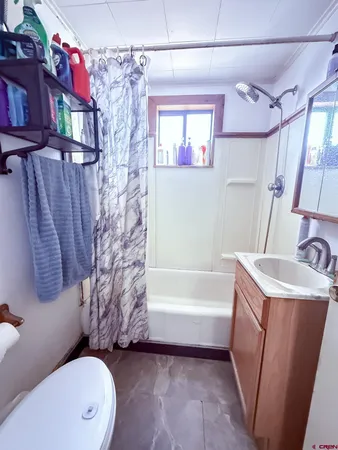 a bedroom with furniture and a wooden floor