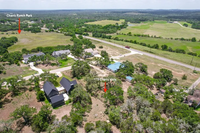 an aerial view of lake residential house and outdoor space