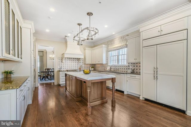 a kitchen with granite countertop a stove and a sink