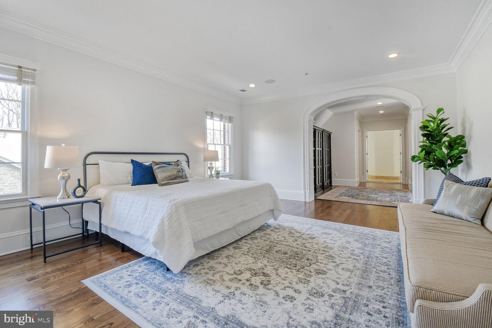 1935 Foxview Circle Northwest Washington, DC 20007 - Photo 20 of 52 a bedroom with a large bed and a couch