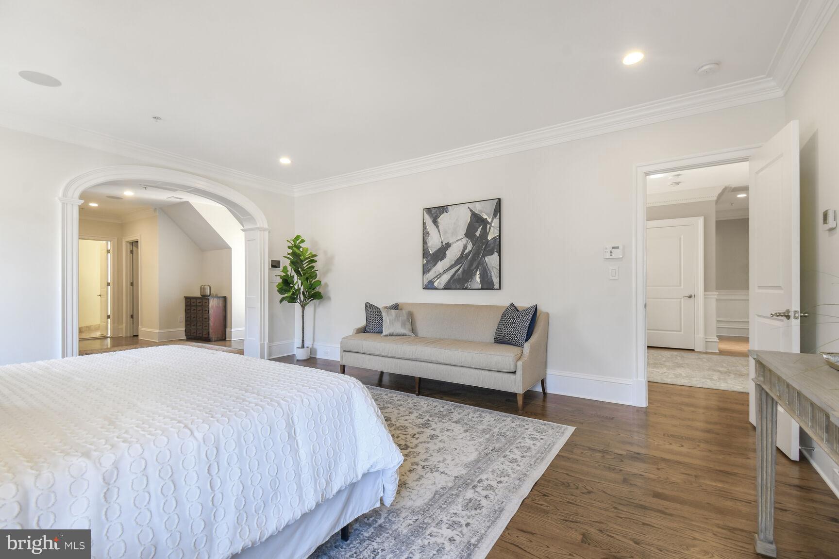 1935 Foxview Circle Northwest Washington, DC 20007 - Photo 21 of 52 a spacious bedroom with a balcony a bed and a couch