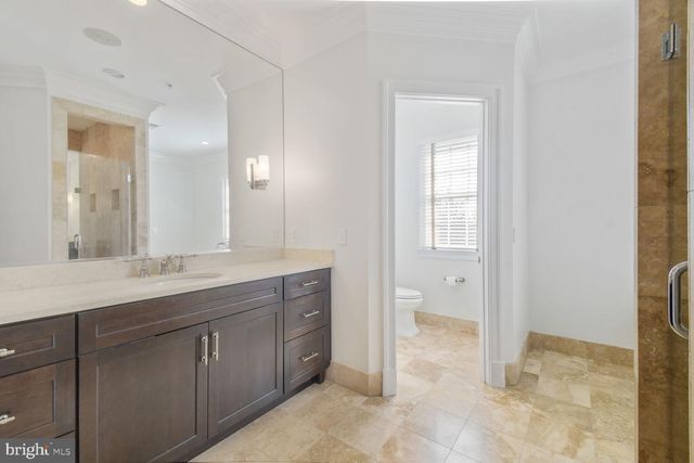 a spacious bathroom with a granite countertop sink a mirror and a