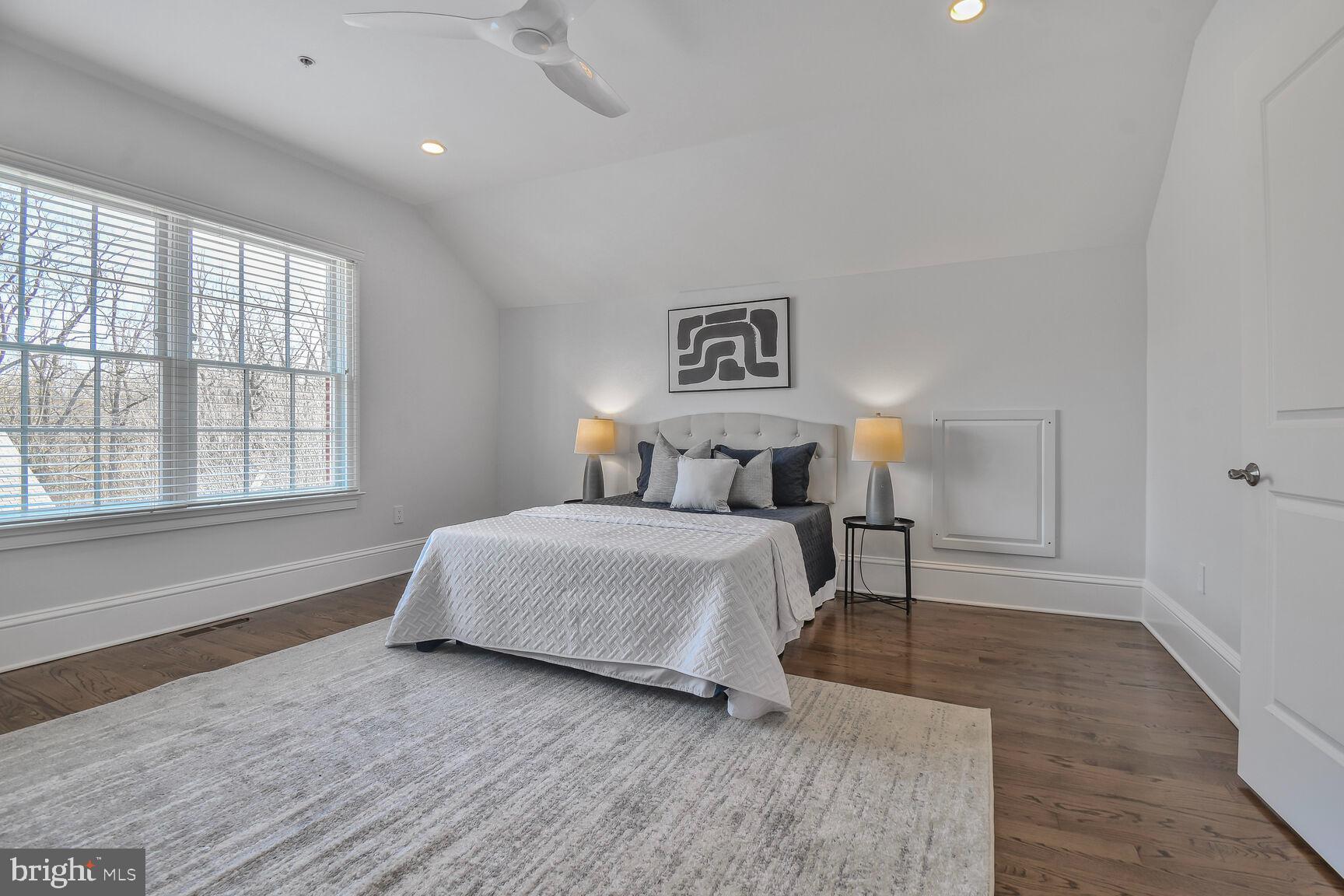 1935 Foxview Circle Northwest Washington, DC 20007 - Photo 35 of 52 a bedroom with a bed and a large window