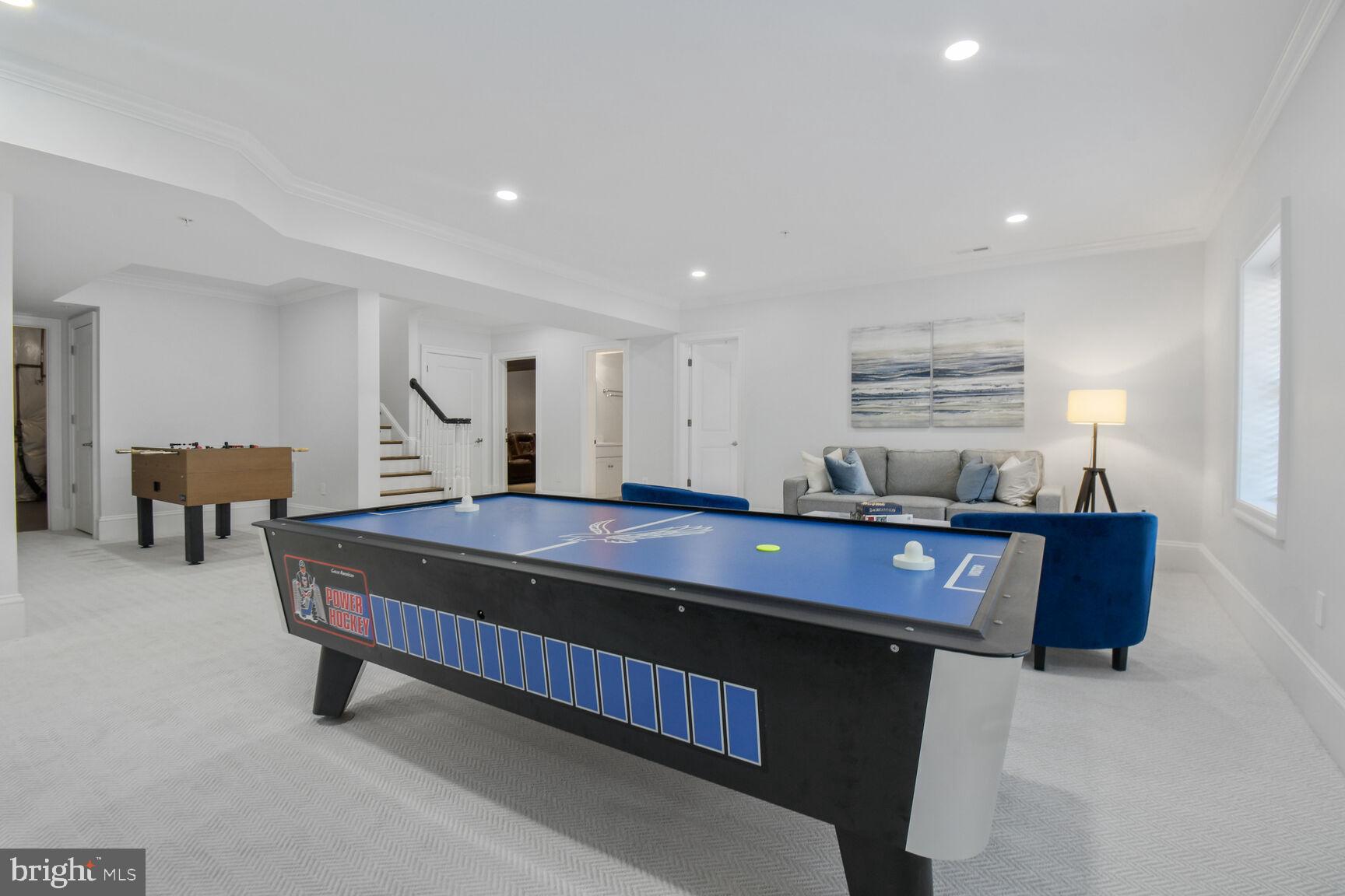 1935 Foxview Circle Northwest Washington, DC 20007 - Photo 43 of 52 a living room with furniture a table and a flat screen tv