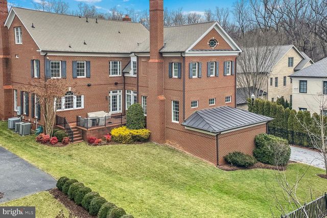 wooden floor in an entryway with a dining room