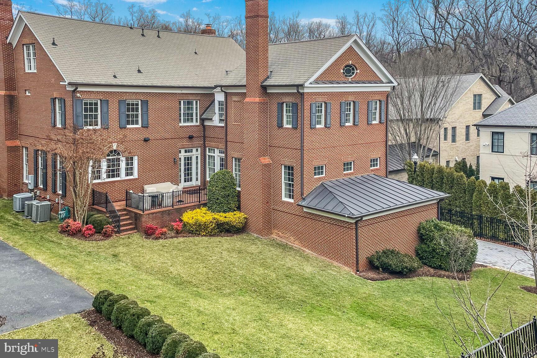 1935 Foxview Circle Northwest Washington, DC 20007 - Photo 5 of 52 a front view of a house with garden