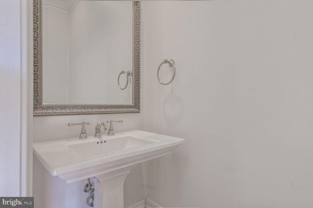 a living room with furniture fireplace and a table