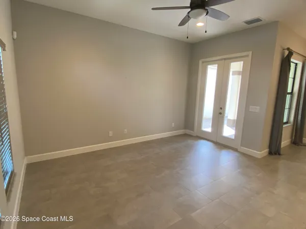 a dining room with furniture and chandelier