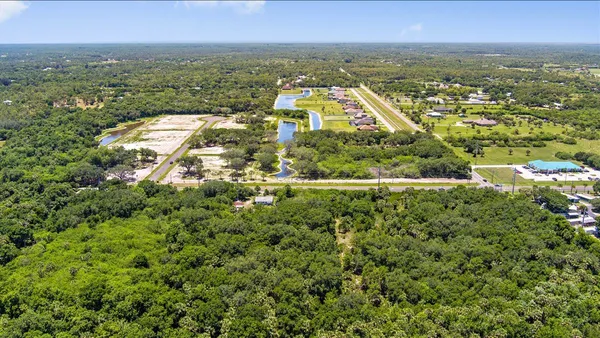 an aerial view of residential building and lake view