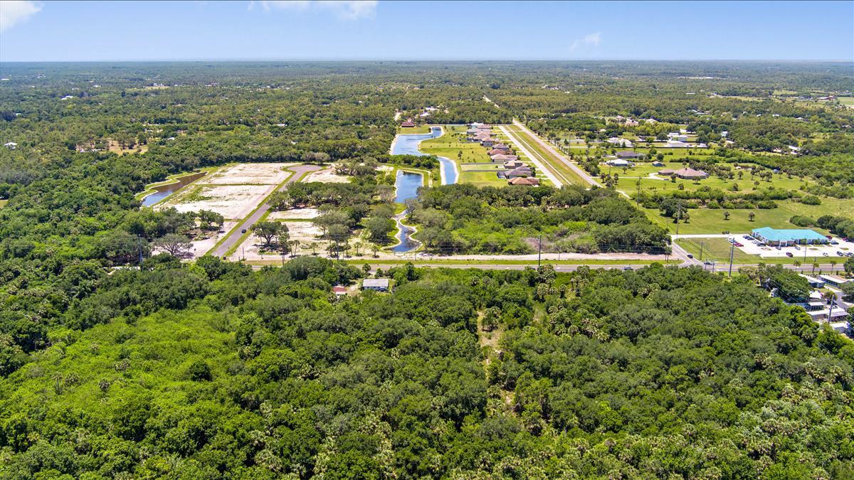 880 Malabar Road Malabar, FL 32950 - Photo 5 of 7 an aerial view of residential building and lake view