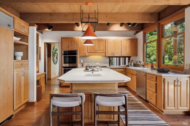 a kitchen with a table and chairs in it