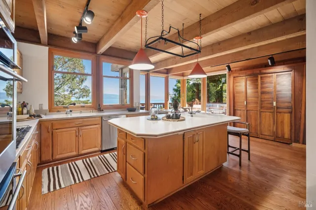a kitchen with a table and chairs in it