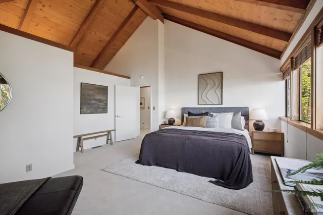 a bedroom with bed and a window