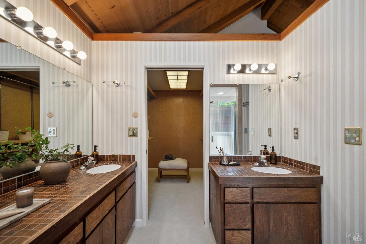 2490 Spanish Trail Road Tiburon, CA 94920 - Photo 25 of 32 a bathroom with a sink and a mirror
