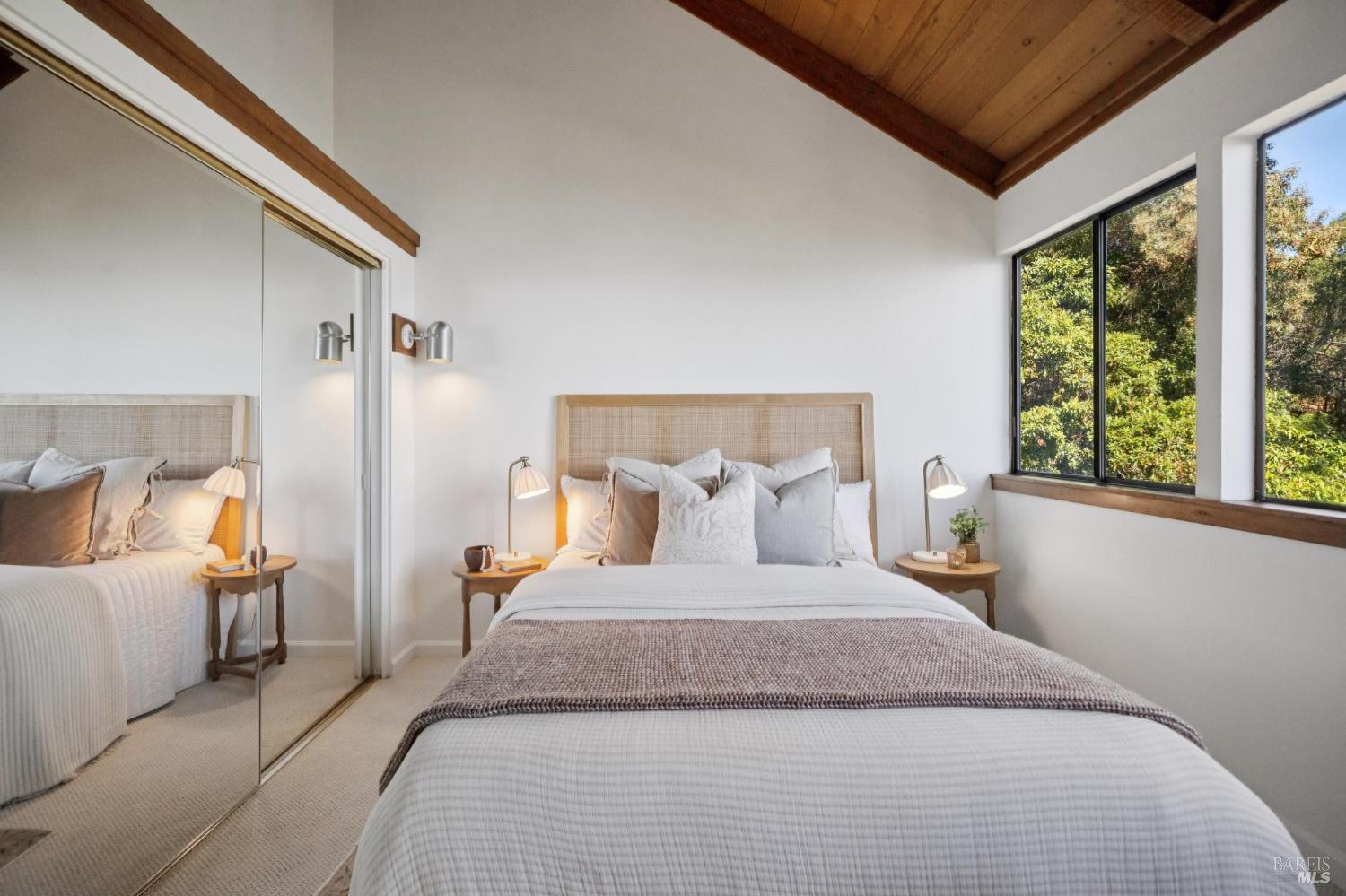 2490 Spanish Trail Road Tiburon, CA 94920 - Photo 28 of 32 a bedroom with a large bed and a large window