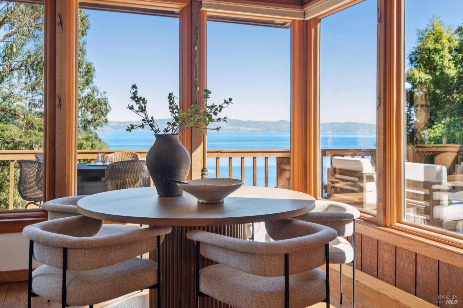 2490 Spanish Trail Road Tiburon, CA 94920 - Photo 4 of 32 a view of a dining room with furniture window and wooden floor