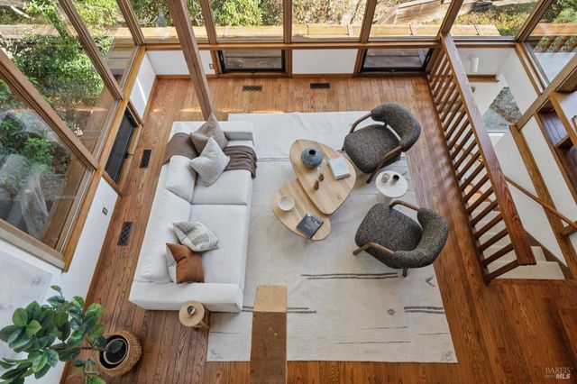 a view of a house with pool and chairs