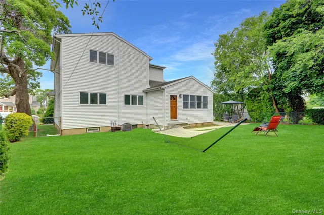 a view of a chairs and table under an umbrella