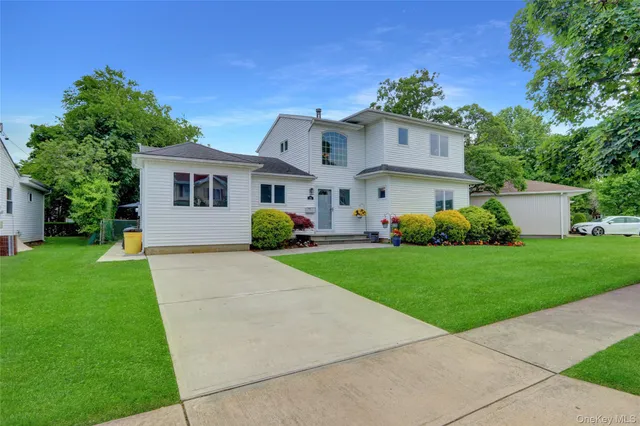 a front view of house with yard and green space