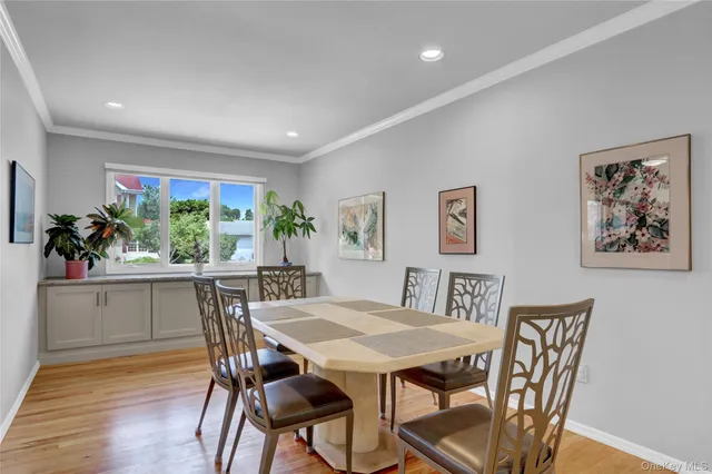 a view of a dining room with furniture and window