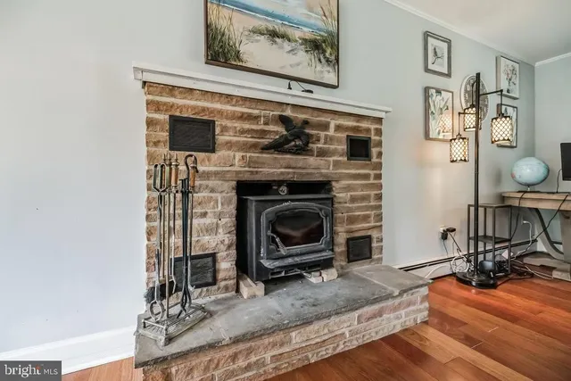 a view of a livingroom with furniture and a fireplace