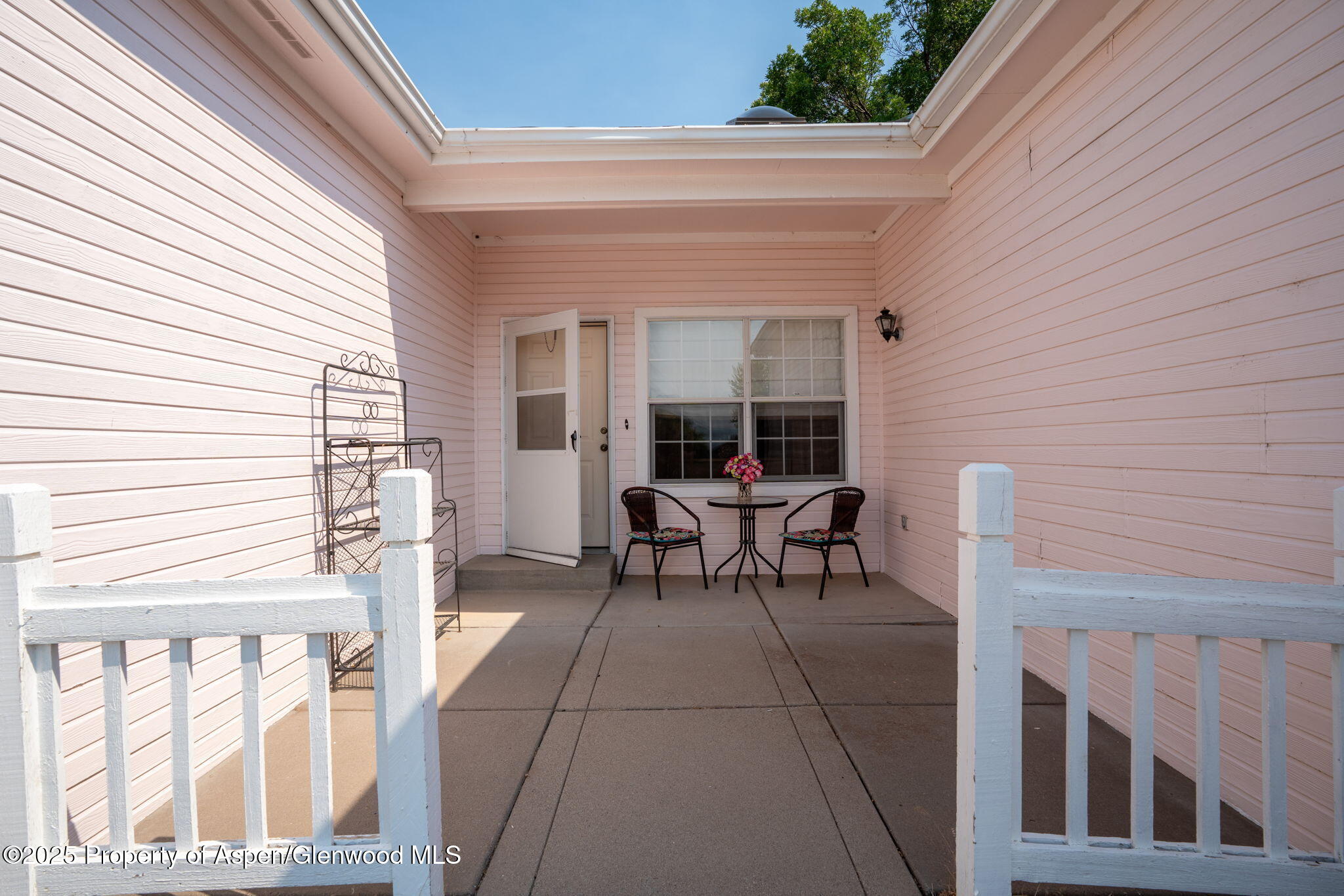 72 Juniper Lane Battlement Mesa, CO 81635 - Photo 19 of 23 a view of a patio with table and chairs and couches with wooden floor and fence