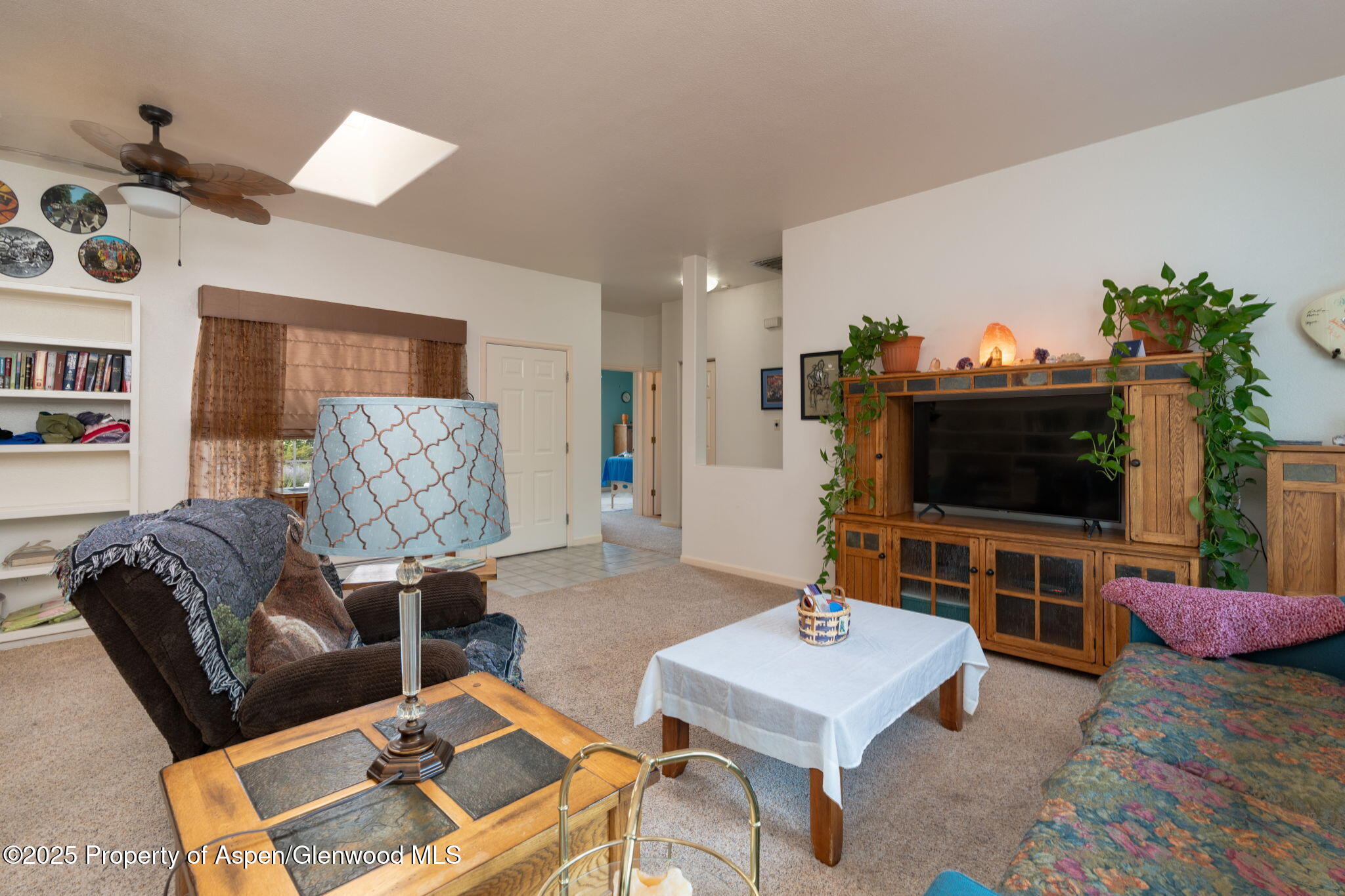 72 Juniper Lane Battlement Mesa, CO 81635 - Photo 2 of 23 a living room with furniture and a flat screen tv