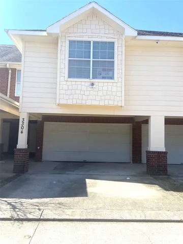 a bathroom with a bathtub and a window