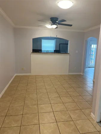a view of a livingroom with an empty space and a chandelier