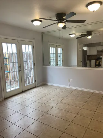 a view of an empty room and a window