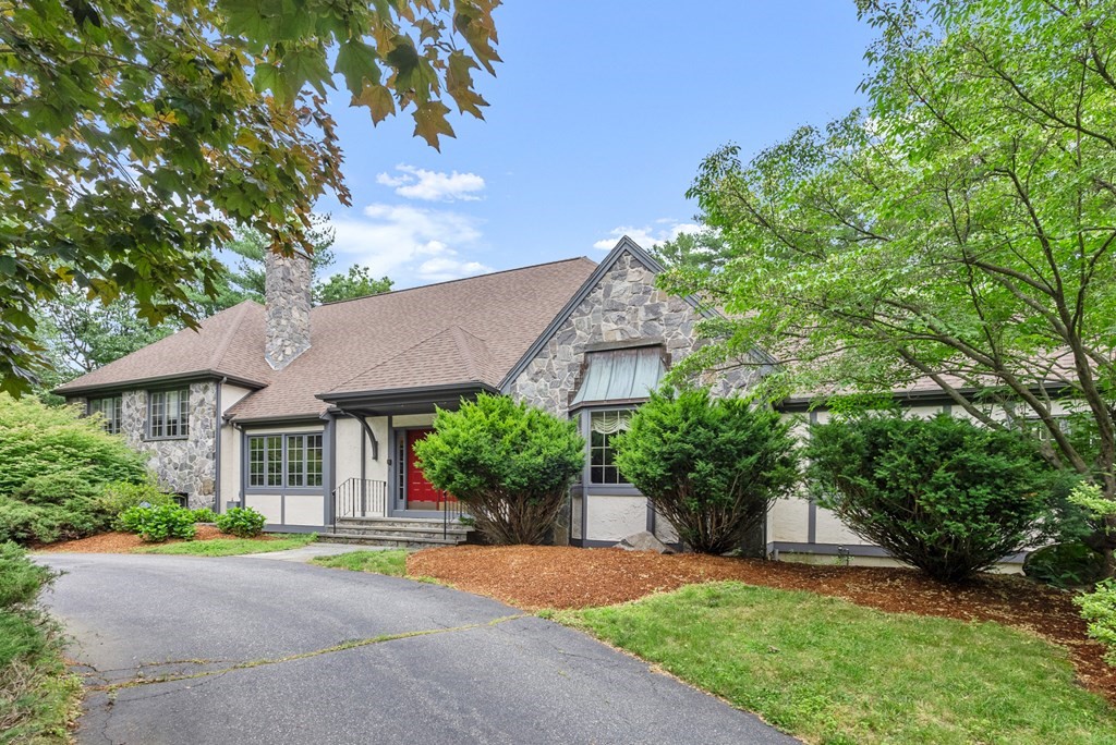 26 Fox Run Road Sudbury, MA 01776 - Photo 1 of 42 a front view of a house with a yard and a garden
