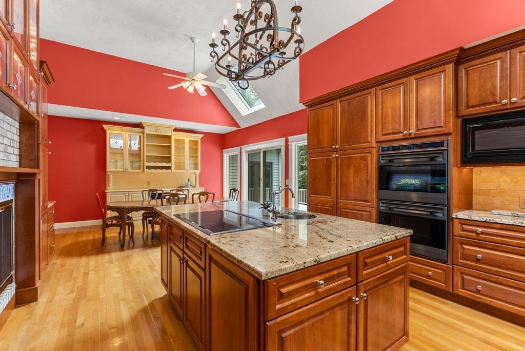 26 Fox Run Road Sudbury, MA 01776 - Photo 11 of 42 a kitchen with stainless steel appliances granite countertop a sink and cabinets