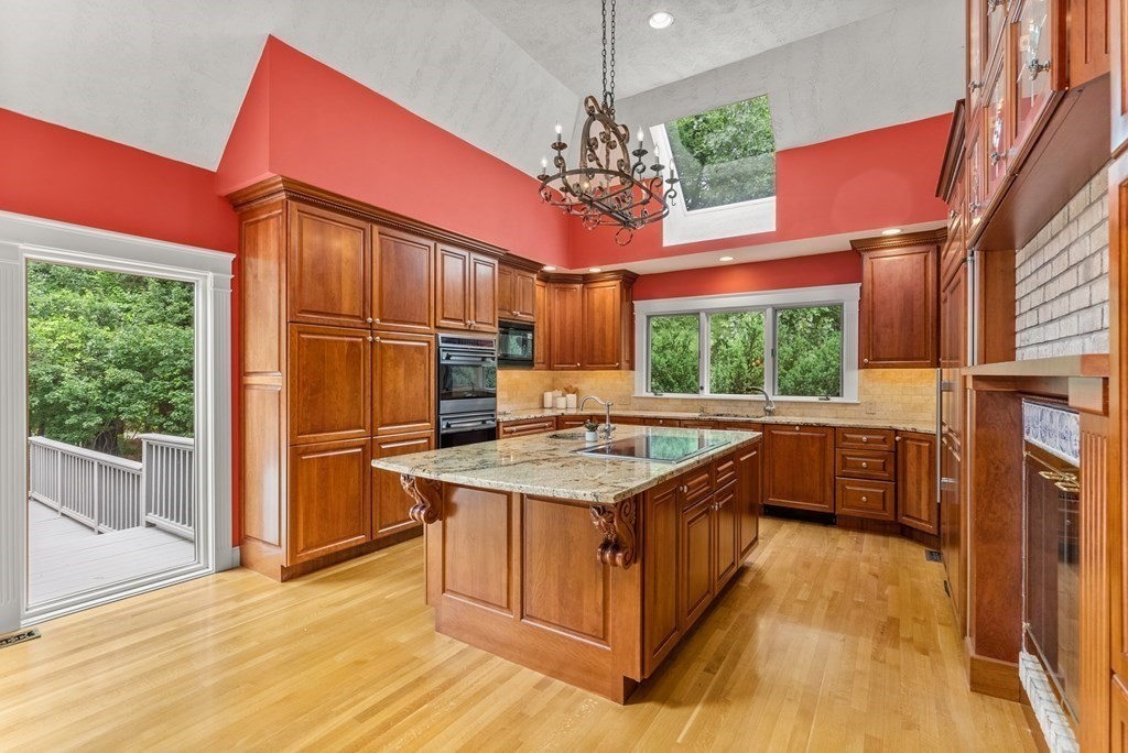 26 Fox Run Road Sudbury, MA 01776 - Photo 12 of 42 a kitchen that has a kitchen island wooden floor and a window