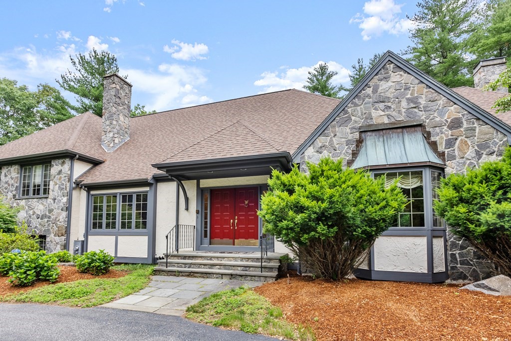26 Fox Run Road Sudbury, MA 01776 - Photo 2 of 42 a front view of a house with a garden