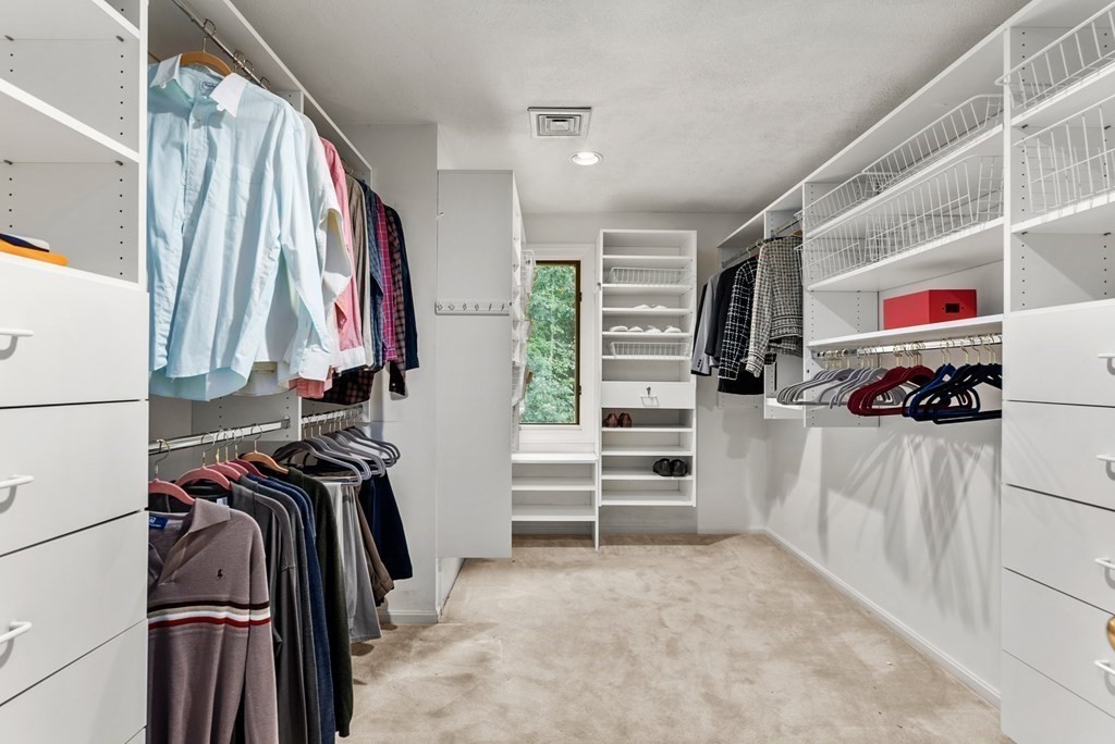 26 Fox Run Road Sudbury, MA 01776 - Photo 23 of 42 a view of walk in closet with clothes and shoes