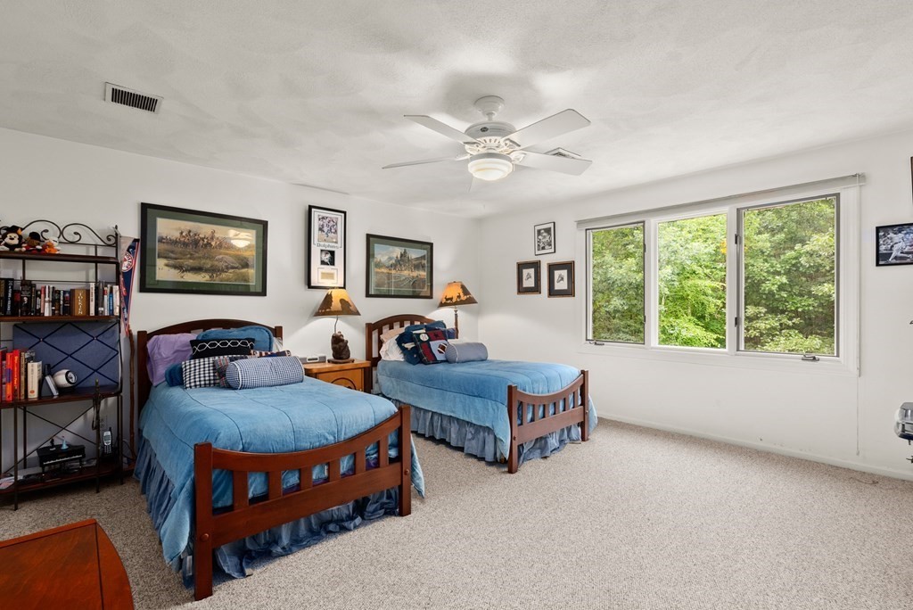 26 Fox Run Road Sudbury, MA 01776 - Photo 28 of 42 a bedroom with furniture and a large window