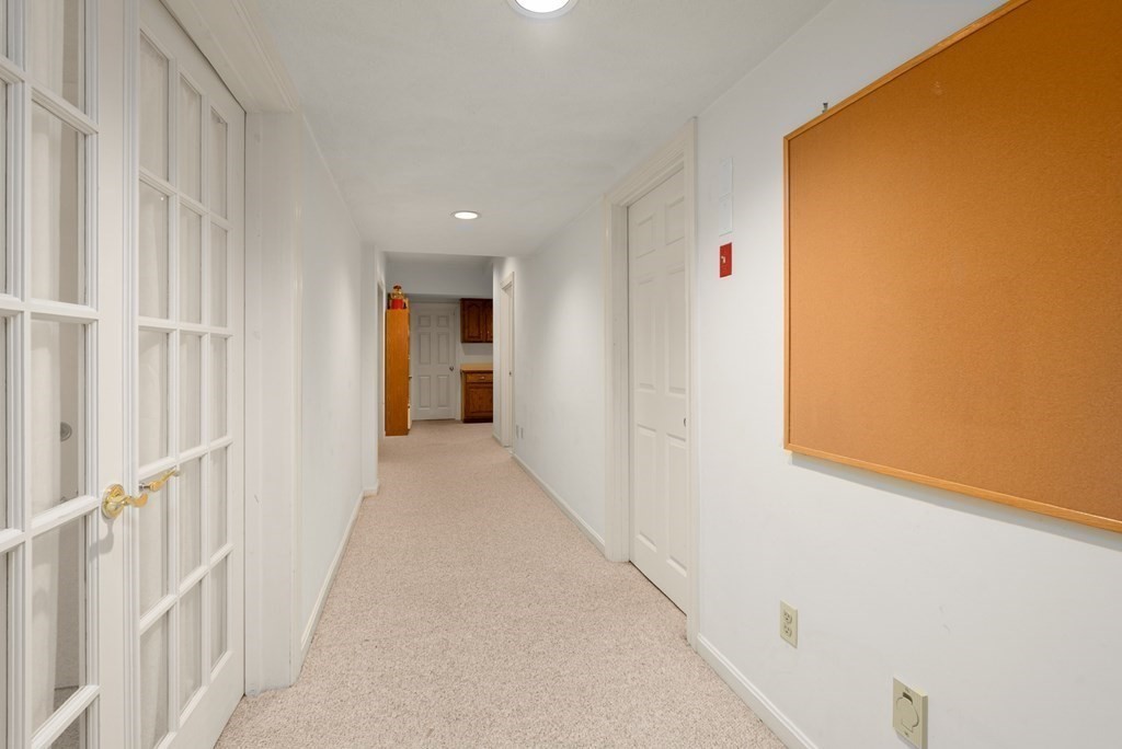 26 Fox Run Road Sudbury, MA 01776 - Photo 31 of 42 a view of a hallway with a white walls