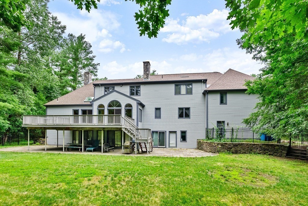 26 Fox Run Road Sudbury, MA 01776 - Photo 36 of 42 a front view of a house with a garden