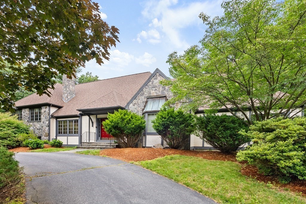 26 Fox Run Road Sudbury, MA 01776 - Photo 39 of 42 a front view of a house with a yard and garage